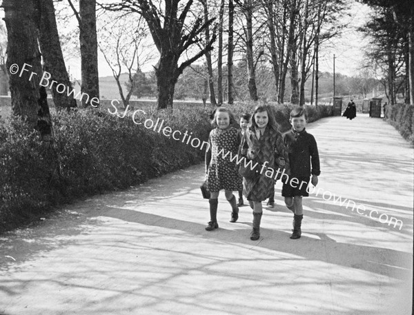 SCHOOL CHILDREN ON COUNTRY ROAD